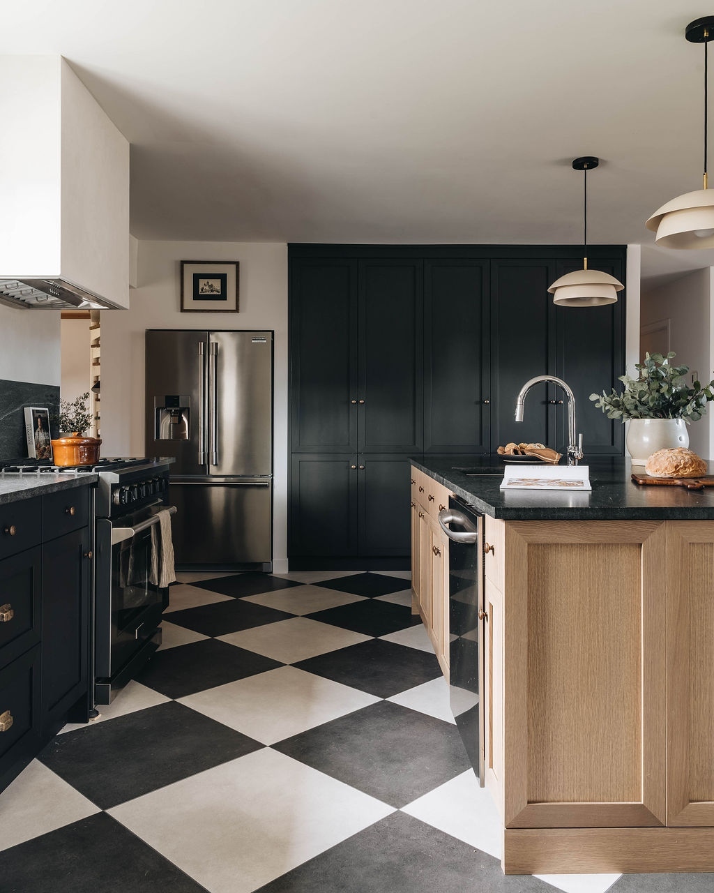 The checkerboard pattern can be used to visually widen small spaces; the larger the squares, the wider the floor area will seem. Bigger tiles mean fewer lines to distract the eye which can make all the difference in compact kitchen areas.