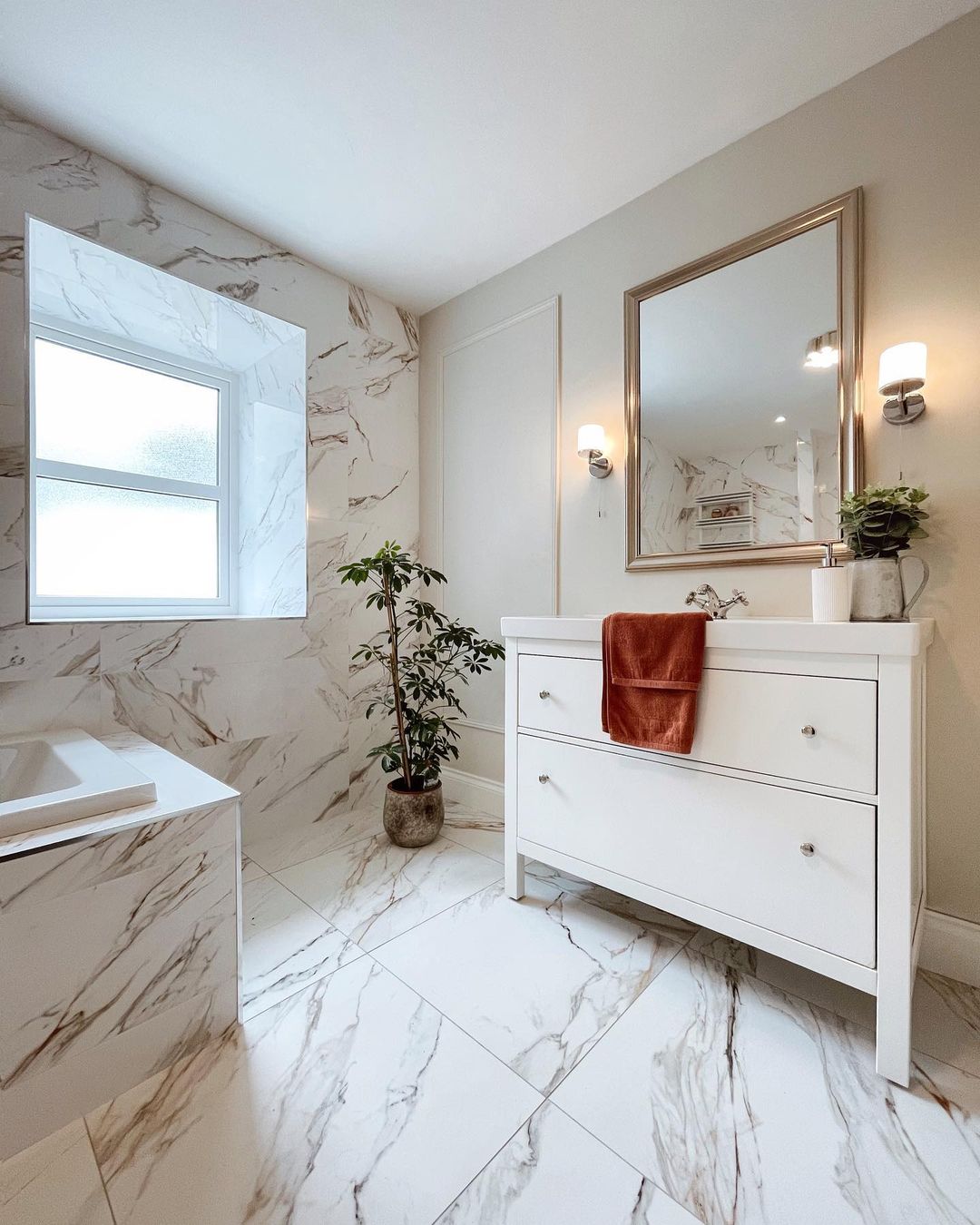 If you love the idea of a real marble bathroom but are put off by its vulnerabilities, keep reading to discover why marble-effect porcelain tiles are an excellent alternative.