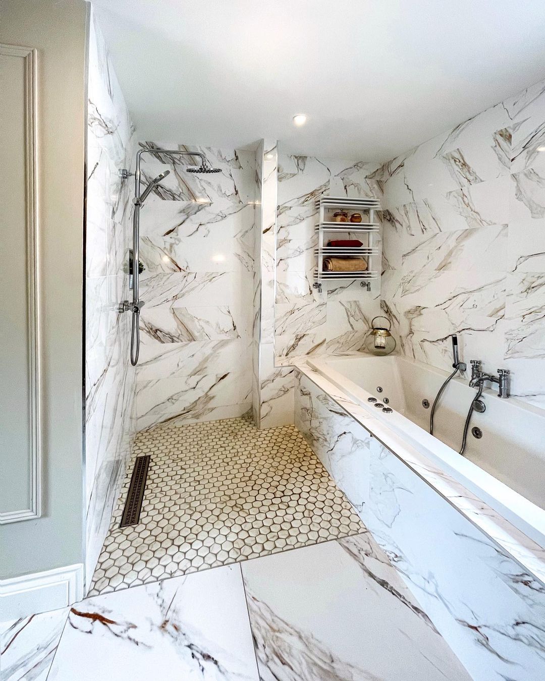 Polished marble tiles are beautiful and can be a great option for bathroom floors but if you’re worried that they may be too slippery, you can opt for non-slip mosaic tiles on wet floor areas.