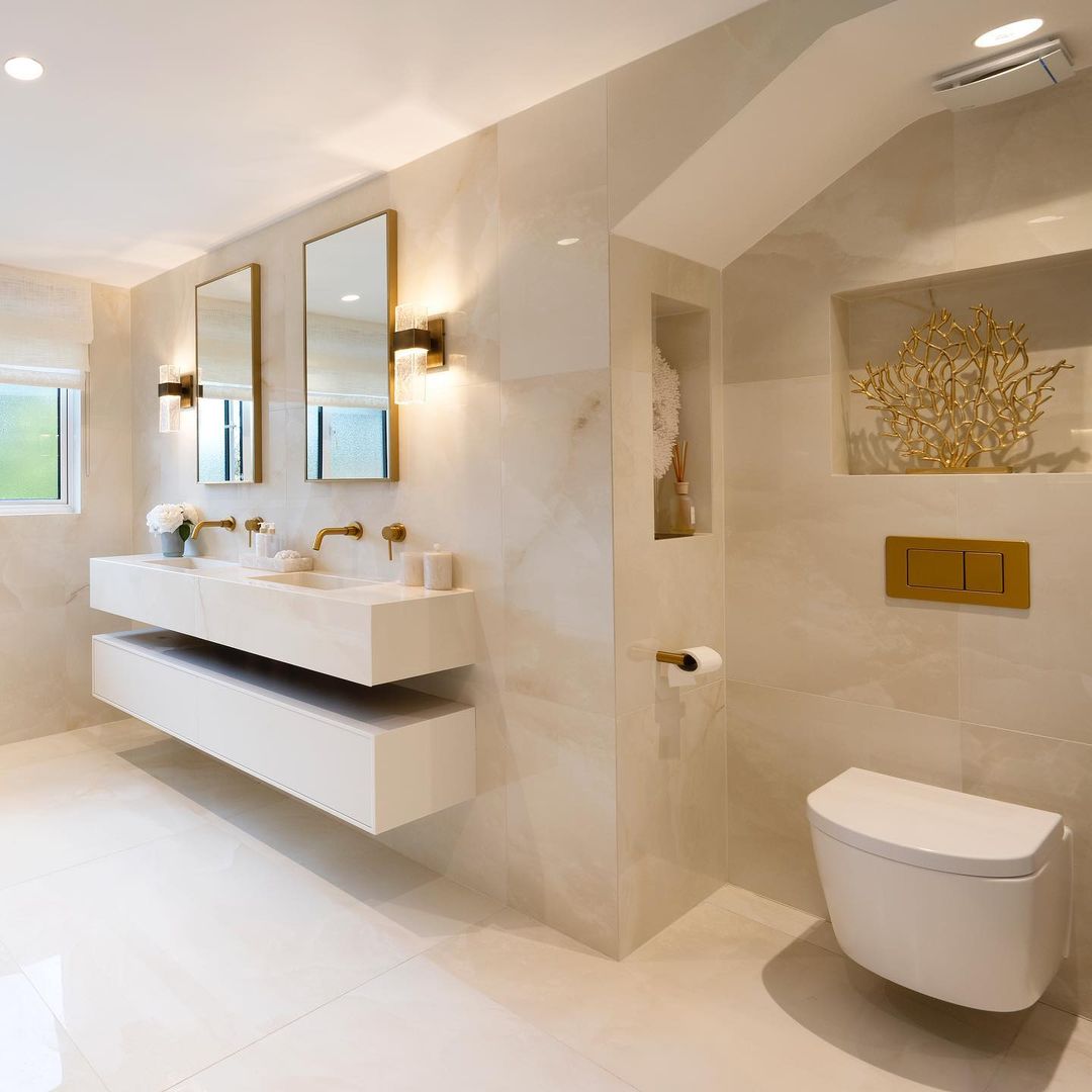 Choosing the same tiles for the floors and ceiling is one of the best ways to get the luxe look in a bathroom.