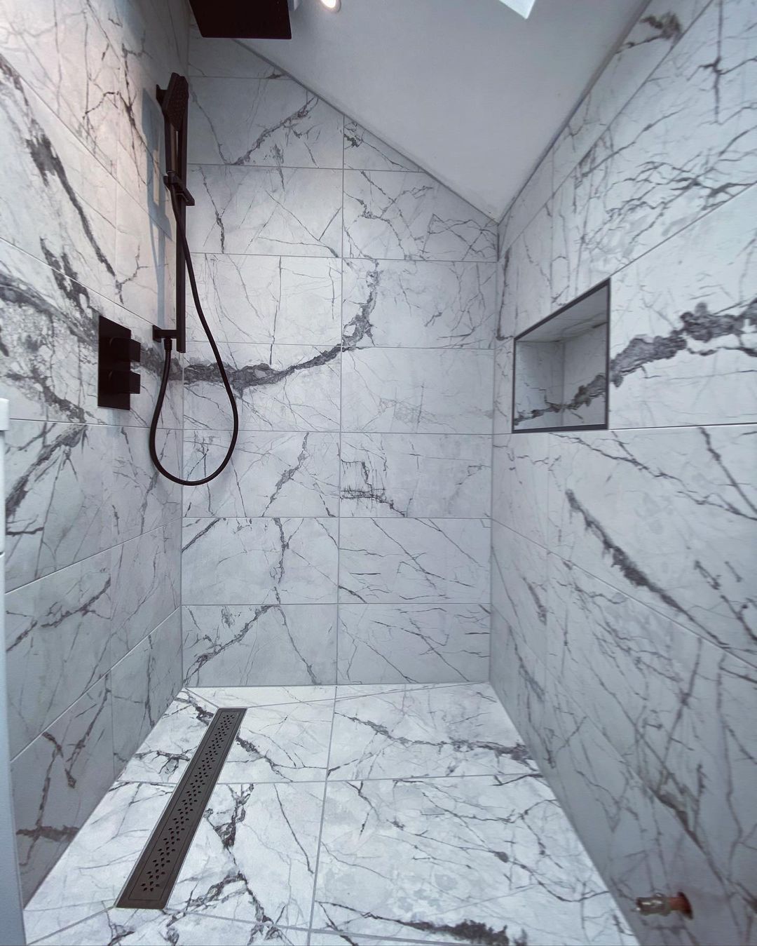 Practical and durable, marble-effect porcelain tiles are ideal for cladding shower enclosures and wet rooms.