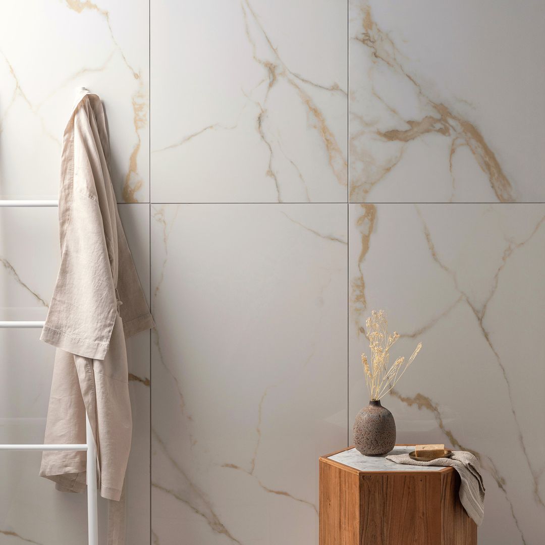 It’s hard to get a more high-end look than marble, but if you want to turn it up a notch, look for gold-flecked marble effect tiles.